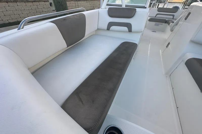 Slide: The Image of 2021 World Cat 230 SD boat interior with cushioned seating and modern design. - 43