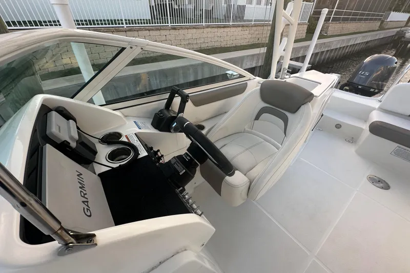 Slide: The Image of 2021 World Cat 230 SD boat interior with Garmin navigation system and comfortable seating. - 53