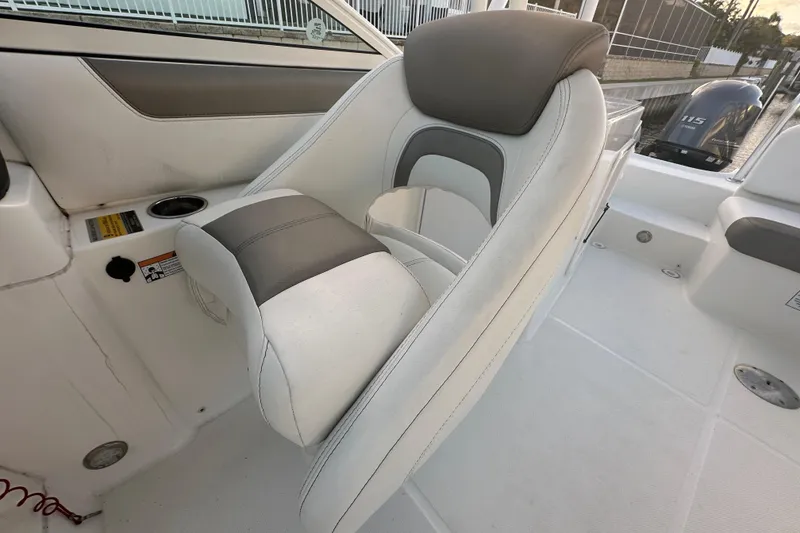 Slide: The Image of 2021 World Cat 230 SD boat seat with gray and white upholstery. - 55