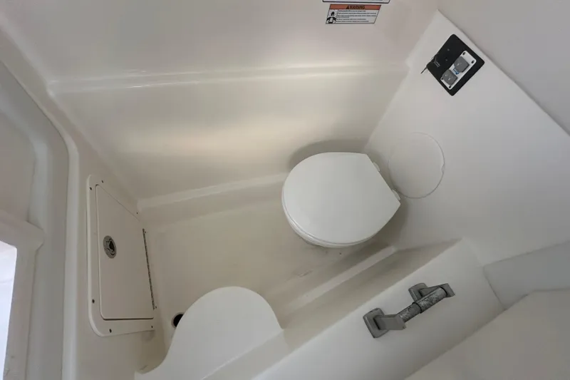 Slide: The Image of Interior view of 2021 World Cat 230 SD boat bathroom with toilet. - 72