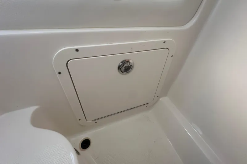 Slide: The Image of Storage compartment on 2021 World Cat 230 SD boat interior. - 73