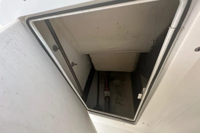 Slide: The Image of Storage compartment on a 2021 World Cat 230 SD boat, showing interior details. - 78