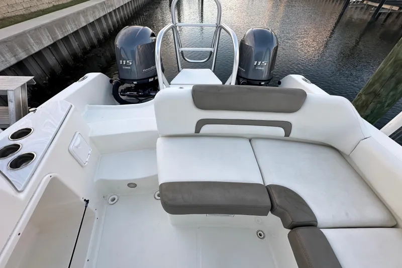 Slide: The Image of 2021 World Cat 230 SD boat with dual Yamaha 115 engines and comfortable seating. - 87