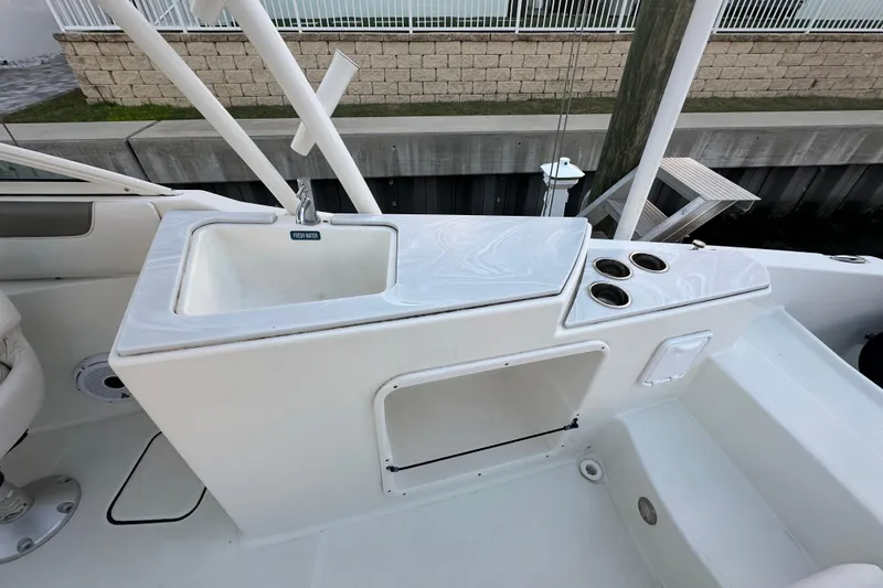 Slide: The Image of 2021 World Cat 230 SD boat sink and cup holders on deck. - 88