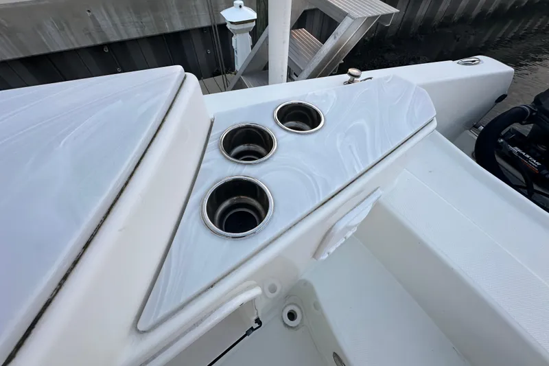 Slide: The Image of 2021 World Cat 230 SD boat with three stainless steel cup holders on deck. - 90