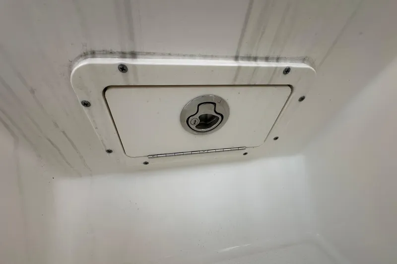 Slide: The Image of Hatch on 2021 World Cat 230 SD boat, featuring secure latch and clean design. - 96