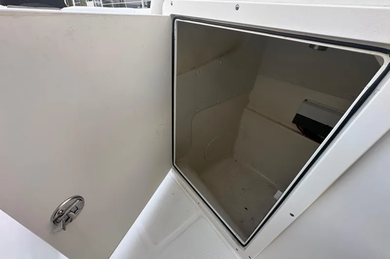 Slide: The Image of Open storage compartment on 2021 World Cat 230 SD boat. - 98