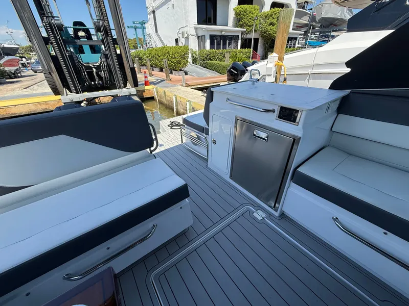 Slide: The Image of Interior of 2022 Cruisers Yachts 34 GLS OB with seating and fridge. - 47
