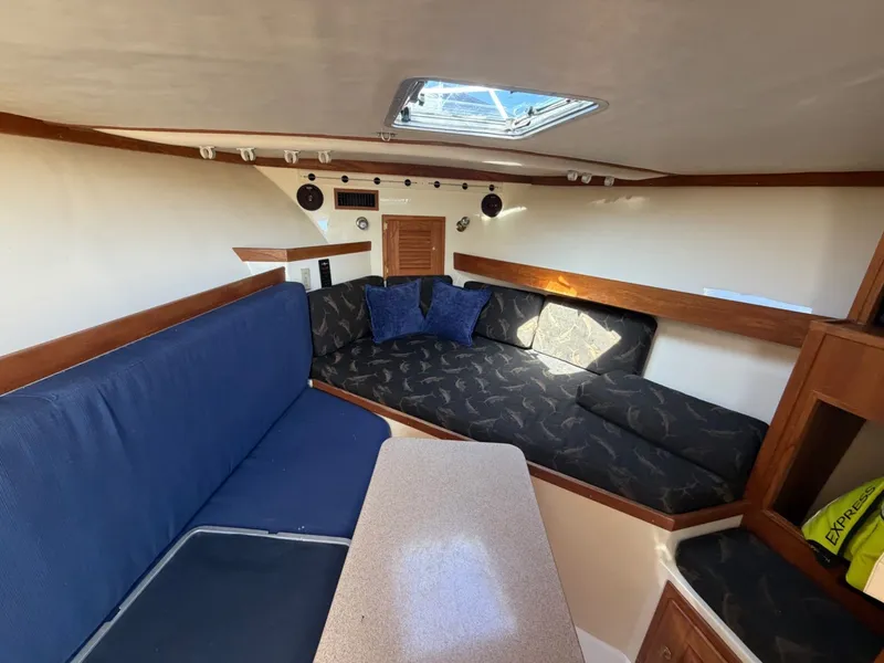 Slide: The Image of Interior of 2002 Albemarle 305 Express Fisherman with blue upholstery. - 22
