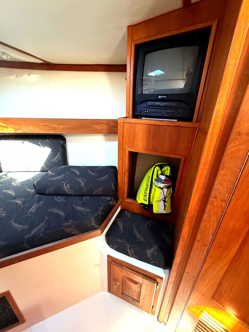 Slide: The Image of Interior of 2002 Albemarle 305 Express Fisherman with TV and storage. - 25