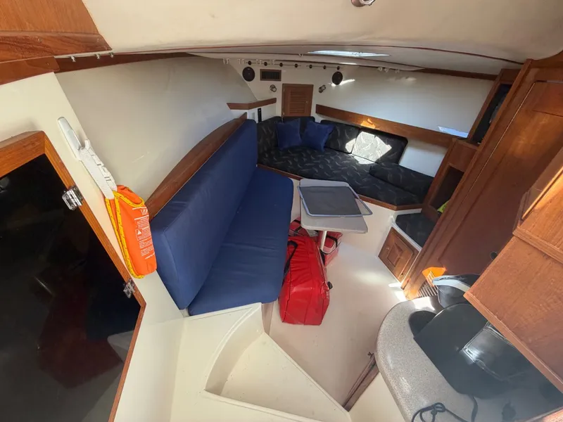Slide: The Image of Interior of 2002 Albemarle 305 Express Fisherman with blue seating. - 27