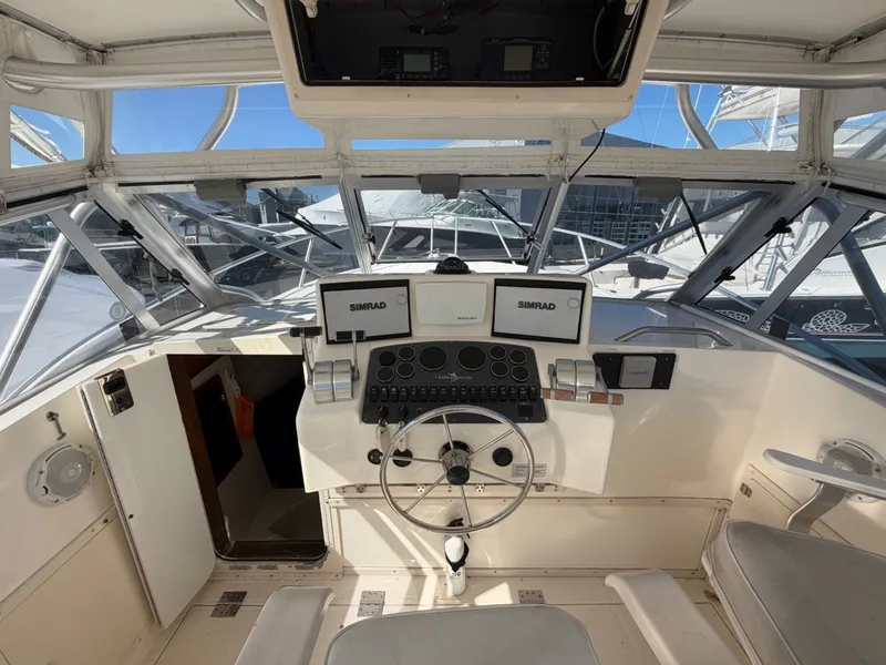 Slide: The Image of Interior view of 2002 Albemarle 305 Express Fisherman cockpit. - 28