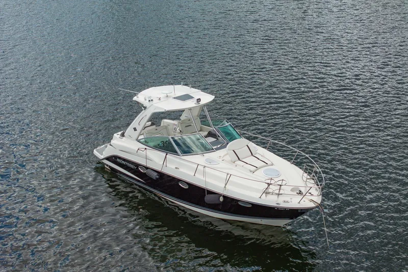 Slide: The Image of 2014 Monterey 320 Sport Yacht cruising on calm waters. - 2