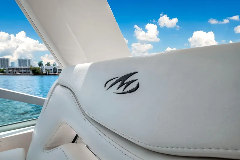 Slide: The Image of 2014 Monterey 320 Sport Yacht interior with logo, overlooking water and skyline. - 22