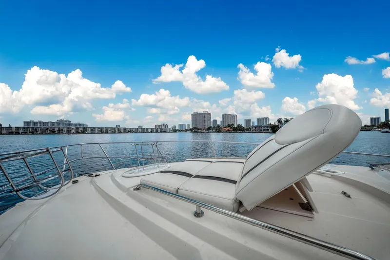 Slide: The Image of 2014 Monterey 320 Sport Yacht on water with city skyline and blue sky. - 26