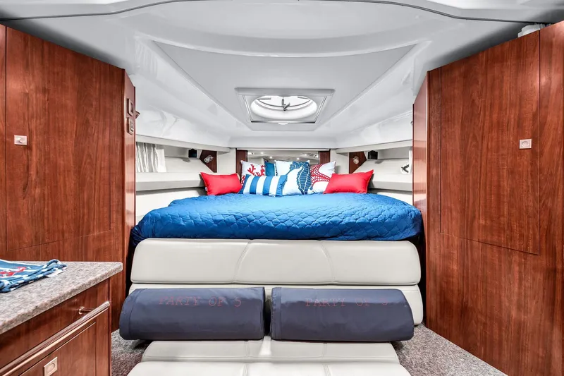 Slide: The Image of Luxurious interior of 2014 Monterey 320 Sport Yacht with cozy bed and elegant wood finish. - 29