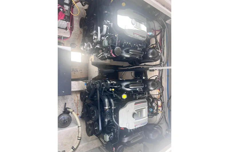 Slide: The Image of Engine compartment of a 2014 Monterey 320 Sport Yacht, featuring dual engines. - 37