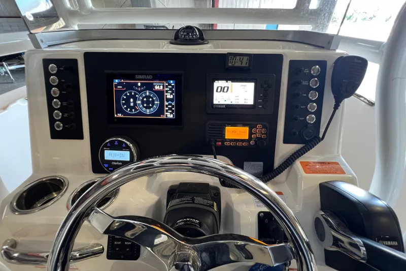 Slide: The Image of 2023 Robalo R200 Center Console dashboard with advanced navigation and control systems. - 12