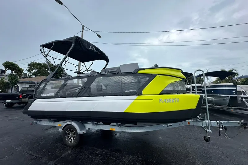 The Image of 2023 Sea-Doo Switch Cruise 21 on trailer, featuring vibrant yellow accents. - 0