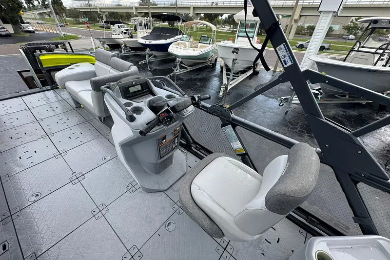 Slide: The Image of 2023 Sea-Doo Switch Cruise 21 interior with steering console and seating. - 12