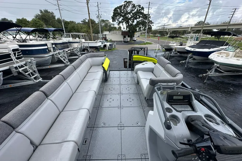 Slide: The Image of 2023 Sea-Doo Switch Cruise 21 pontoon boat with spacious seating and modern design. - 9