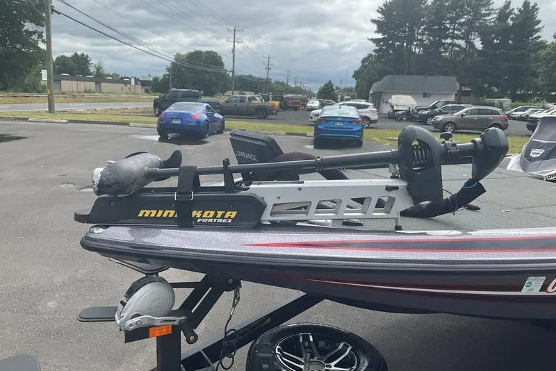 Slide: The Image of 2017 Skeeter FX21 LE boat with Minn Kota Fortrex trolling motor in parking lot. - 21