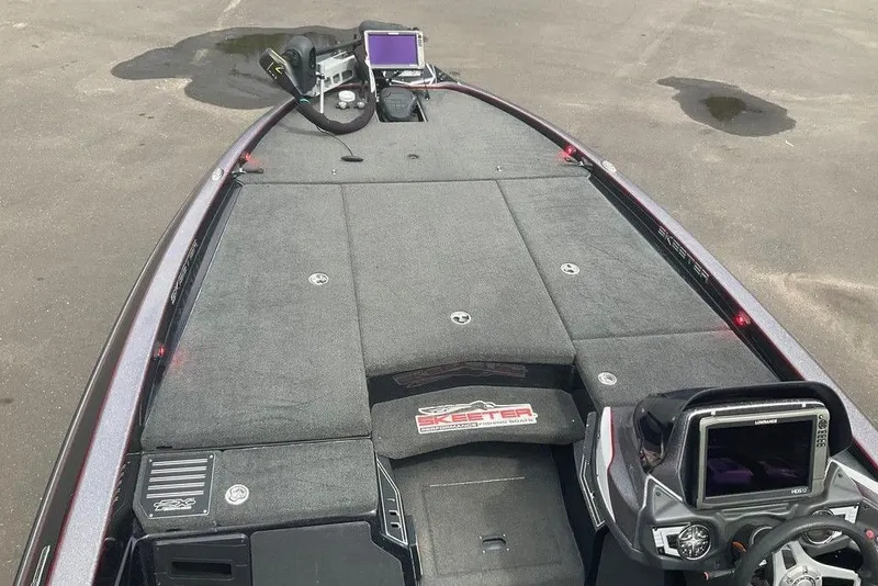 Slide: The Image of 2017 Skeeter FX21 LE boat interior with advanced navigation system and spacious deck. - 23