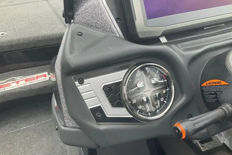Slide: The Image of 2017 Skeeter FX21 LE boat dashboard with gauges and controls. - 34