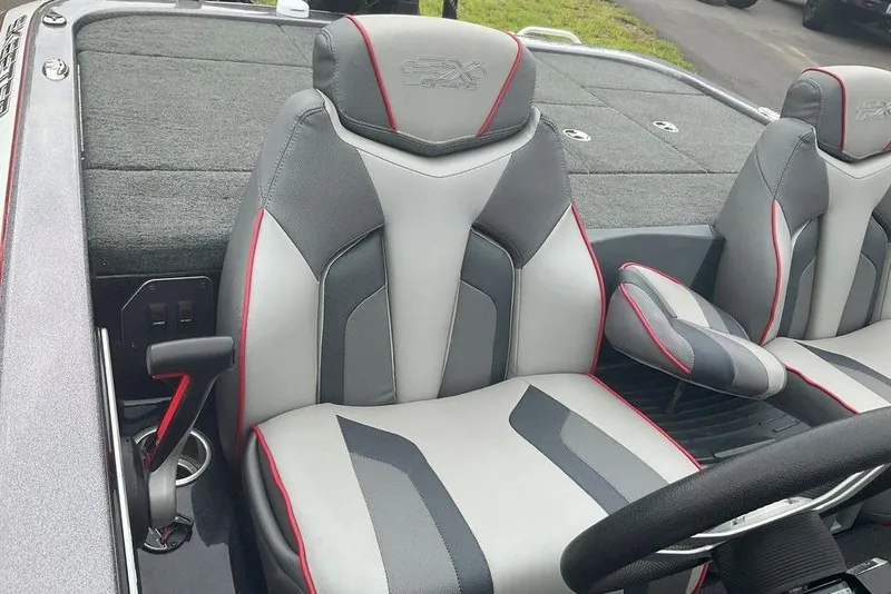 Slide: The Image of 2017 Skeeter FX21 LE boat interior with gray and red seats. - 35
