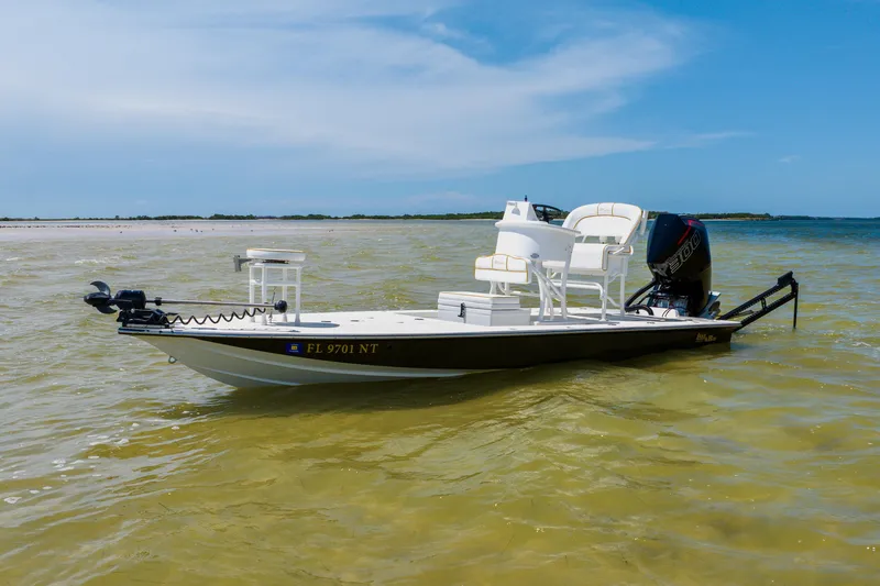 Slide: The Image of 2008 Lake & Bay Boca Grande 20 boat on calm waters under a clear blue sky. - 14