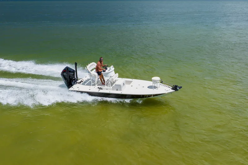 Slide: The Image of 2008 Lake & Bay Boca Grande 20 boat speeding on clear green water. - 21