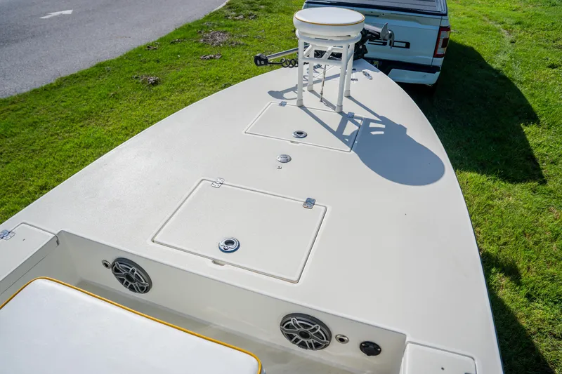 Slide: The Image of 2008 Lake & Bay Boca Grande 20 boat on grass, showing deck and storage compartments. - 27