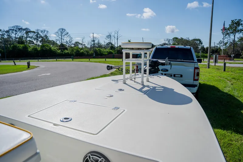 Slide: The Image of 2008 Lake & Bay Boca Grande 20 boat on trailer, parked near a white truck. - 28