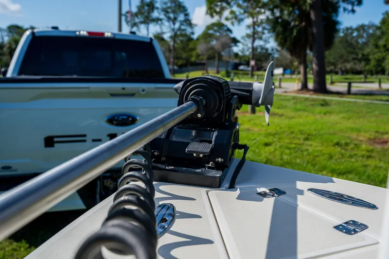 Slide: The Image of 2008 Lake & Bay Boca Grande 20 boat with trolling motor near a Ford F-150 truck. - 36