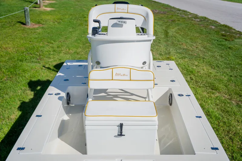 Slide: The Image of 2008 Lake & Bay Boca Grande 20 boat on grass, showcasing seating and console. - 37
