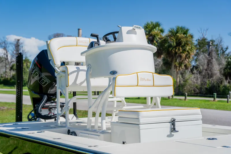 Slide: The Image of 2008 Lake & Bay Boca Grande 20 boat with seating and console, set against a scenic backdrop. - 43