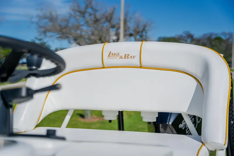 Slide: The Image of 2008 Lake & Bay Boca Grande 20 boat seat with logo, outdoor setting. - 44