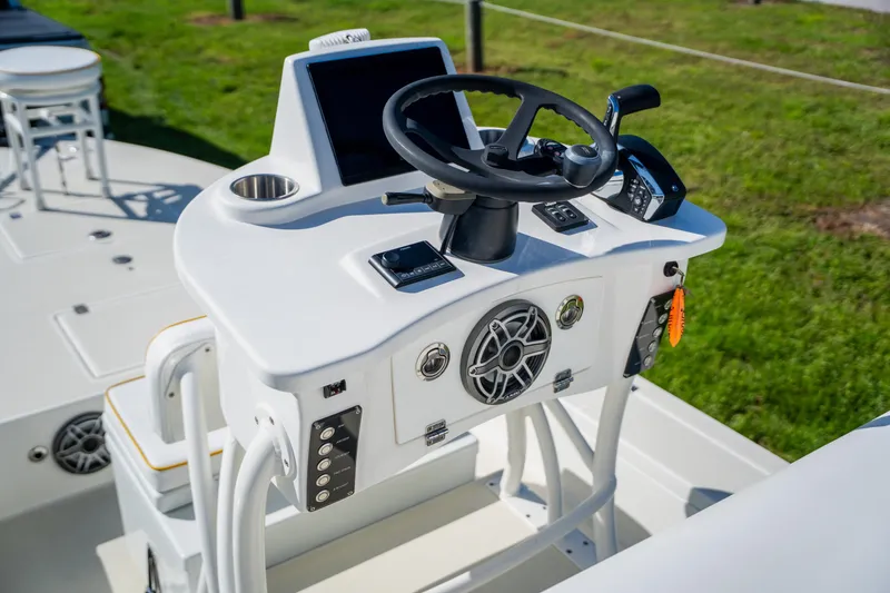 Slide: The Image of 2008 Lake & Bay Boca Grande 20 boat console with steering wheel and controls. - 45