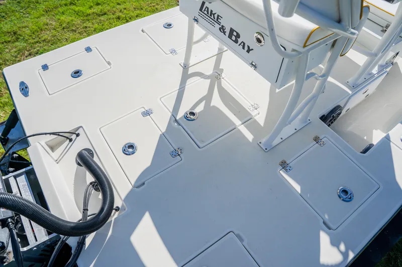 Slide: The Image of 2008 Lake & Bay Boca Grande 20 boat deck with storage compartments and seating. - 48