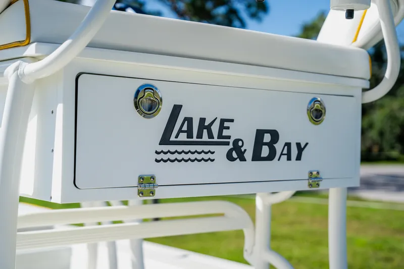 Slide: The Image of Close-up of 2008 Lake & Bay Boca Grande 20 boat logo on white panel. - 51