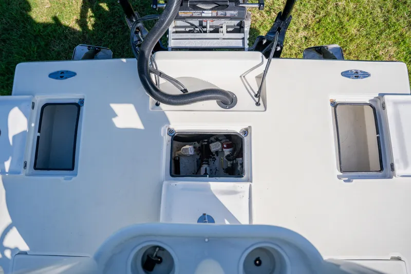 Slide: The Image of 2008 Lake & Bay Boca Grande 20 boat deck with open compartments and equipment. - 52