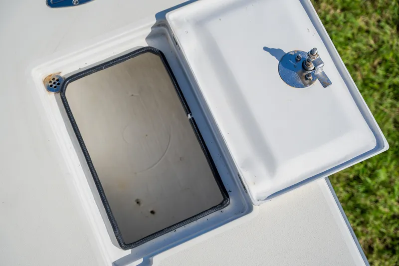 Slide: The Image of Open hatch on 2008 Lake & Bay Boca Grande 20 boat, showing interior compartment. - 53