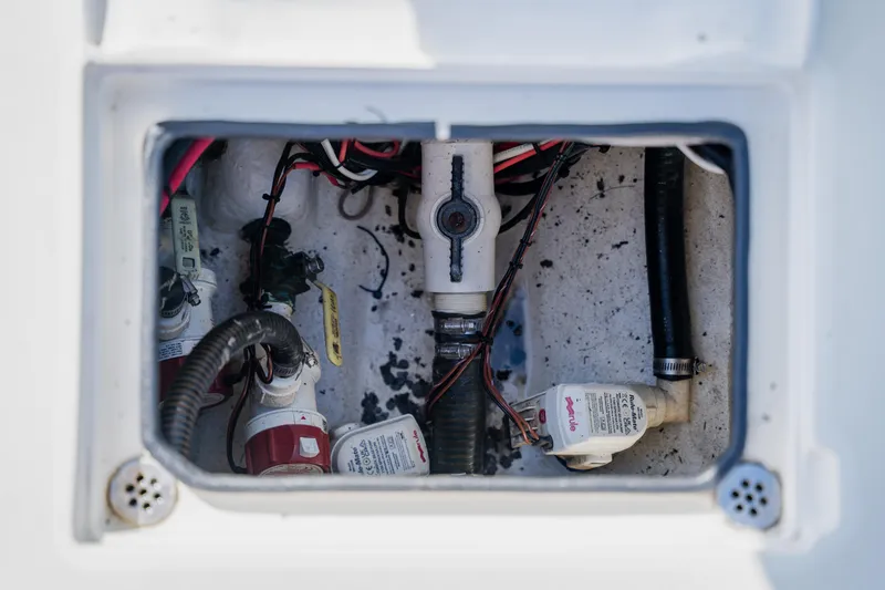 Slide: The Image of 2008 Lake & Bay Boca Grande 20 boat wiring and plumbing compartment. - 55