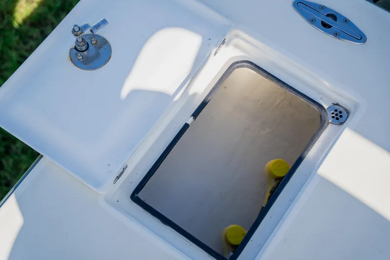 Slide: The Image of 2008 Lake & Bay Boca Grande 20 boat hatch with open compartment and hardware. - 56