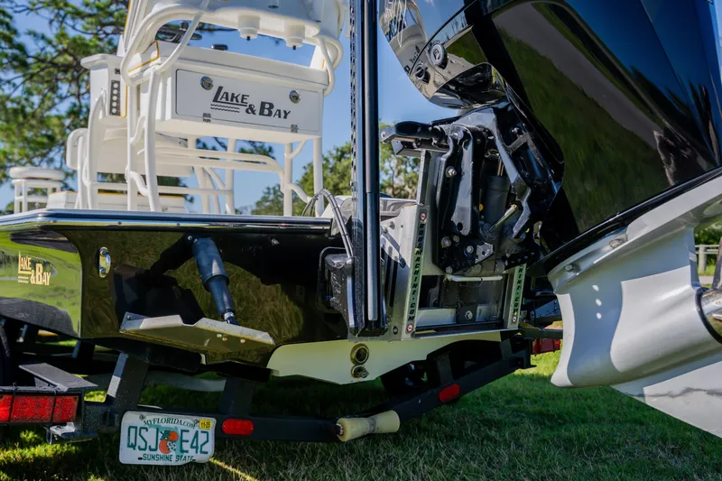 Slide: The Image of 2008 Lake & Bay Boca Grande 20 boat with motor, trailer, and Florida license plate. - 6