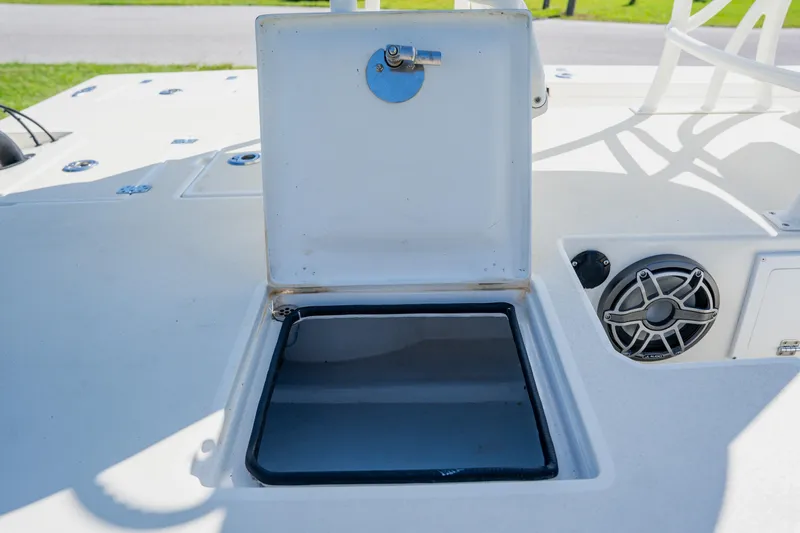 Slide: The Image of 2008 Lake & Bay Boca Grande 20 boat deck with open hatch and speaker. - 61
