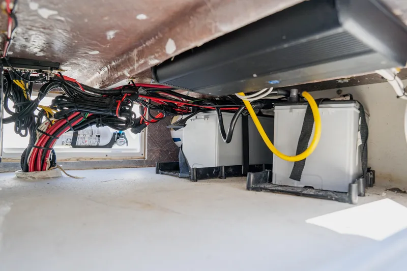Slide: The Image of Underdeck view of 2008 Lake & Bay Boca Grande 20 boat wiring and battery setup. - 68