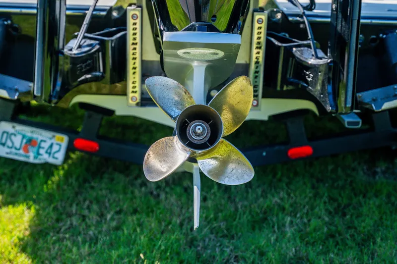 Slide: The Image of Propeller of a 2008 Lake & Bay Boca Grande 20 boat on grass. - 76