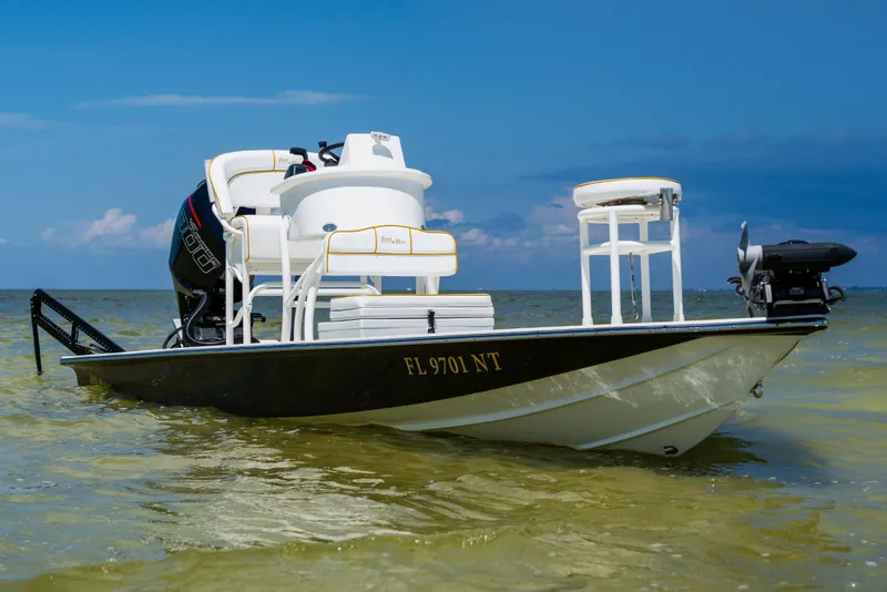 Slide: The Image of 2008 Lake & Bay Boca Grande 20 boat on calm water under blue sky. - 78