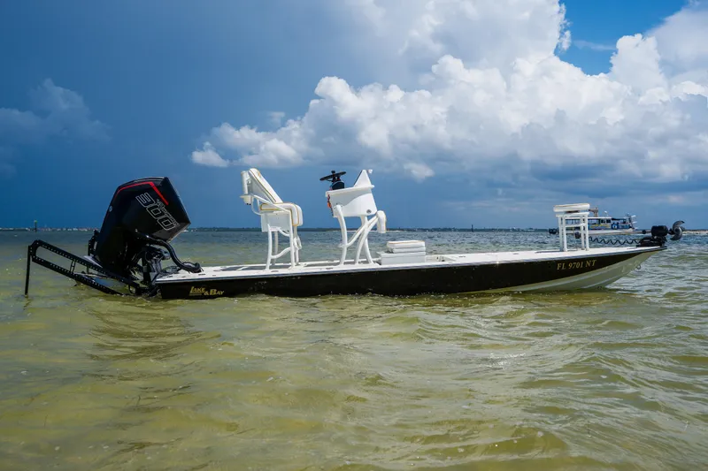 Slide: The Image of 2008 Lake & Bay Boca Grande 20 boat on water under cloudy sky. - 79